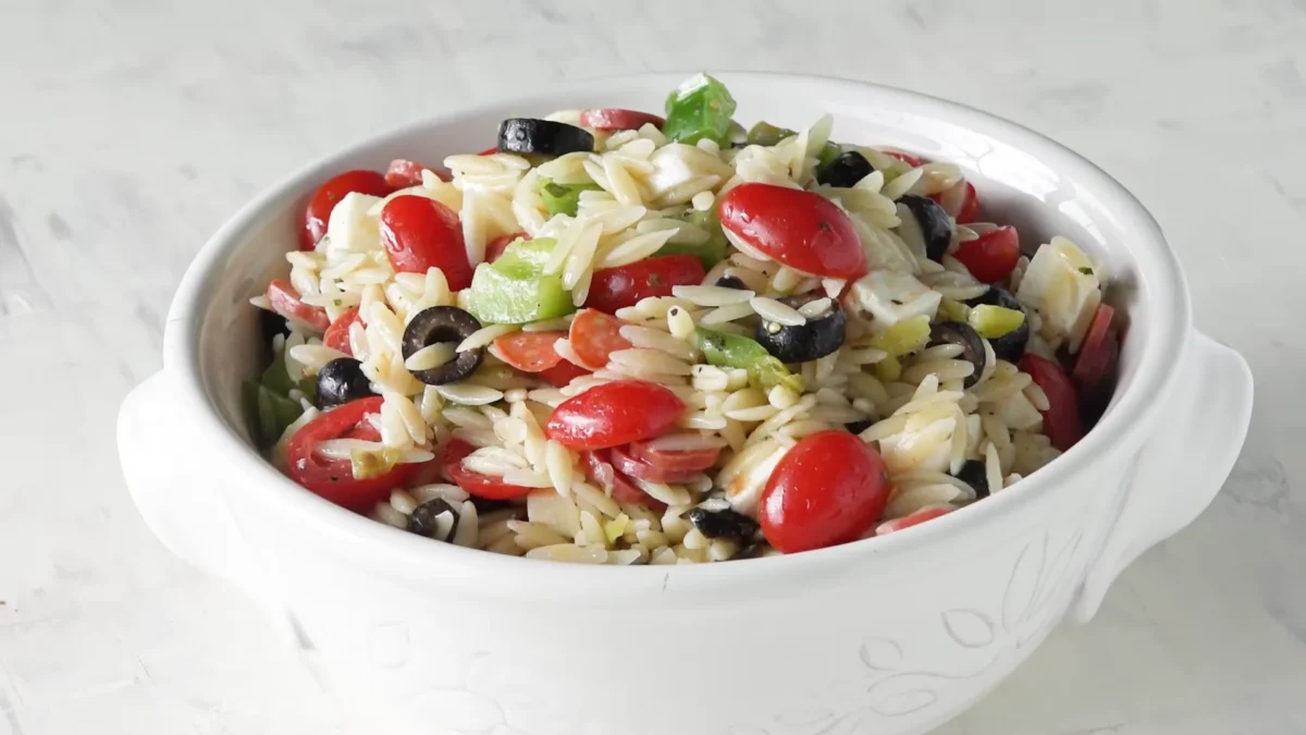 Summer Pasta Salad 20 A delicious bowl of summer pasta salad filled with juicy tomatoes, savory olives, and hearty black beans.